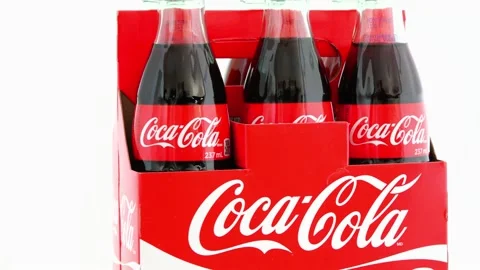 Coca Cola Bottles Turning on a Display | Stock Video | Pond5