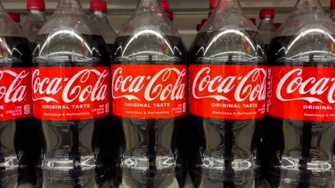 Coca Cola Coke 2 liter bottles on a retail store shelf Stock Footage