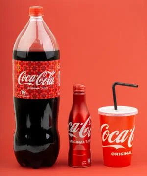 Coca Cola Lantern edition bottle drink over a red  background Stock Photos