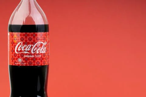 Coca Cola Lantern edition bottle drink over a red  background Fotos Stock