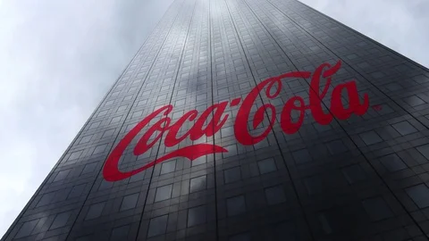 Coca-Cola logo on a skyscraper facade reflecting clouds, time lapse. Editorial Video stock 81063772