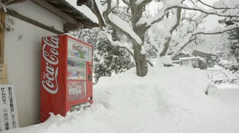 Coca Cola machine buried in the snow, lost in the Japanese mountains. Video stock 11346254