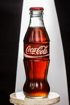 Coca cola, old version of the bottle, glass  isolated background Stock Photos