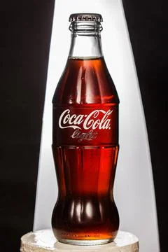 Coca cola, old version of the bottle, glass  isolated background Stock Photos
