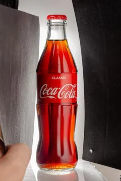 Coca cola, old version glass bottle on an isolated background Stock Photos
