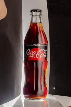 Coca cola, old version glass bottle on an isolated background Stock Photos