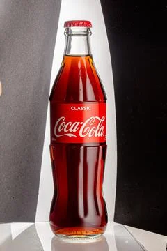 Coca cola, old version glass bottle on an isolated background Stock Photos