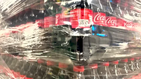 Coca Cola plastic wrapped pallet of 2 liter sodas delivery in a grocery store Stock Footage 244067011