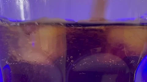 Coca-Cola poured into a glass Stock Footage 233129860