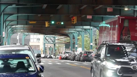 Coca-cola truck. Elevated subway, New York city street. Metropolitan bridge over Stock Footage 320380139