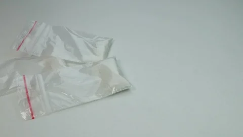 Cocaine and dollars fall on the table Stock Footage 89325071