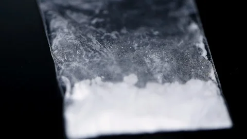 Cocaine on a dark plate (seamless loopable) Stock Footage 124810209