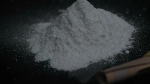 Cocaine powder on black background Stock Footage