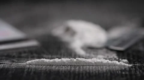 Cocaine snorted off a table, close up Stock Footage