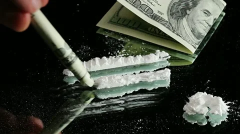 Cocaine Snorted through Rolled 100 Dollar Banknote Video stock 10884386