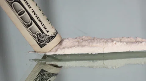Cocaine snorting on a mirror through  100 dollar Stock Footage 44757693