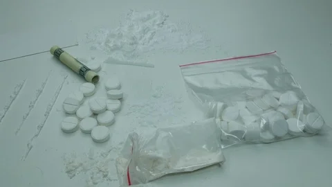 Cocaine strips on white table Stock Footage 89326122