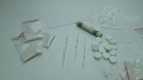 Cocaine strips on white table ready for use Stock Footage 89326131