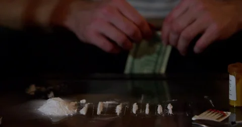 Dollar Bill Scroll Line Of Cocaine Powder And Three Bullets On
