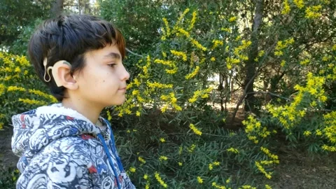 Cochlear implant boy walking 1 Video stock 138845279