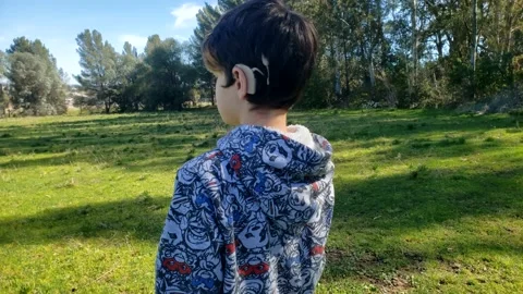 Cochlear implant boy walking 3 Video stock 138850229