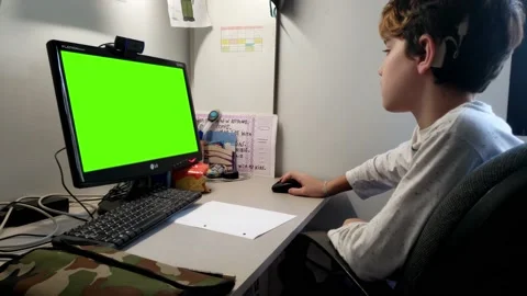 Cochlear implant child usin computer croma Video stock 138711041