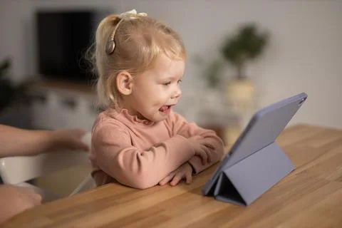 Cochlear implant system. Installation cochlear implant on child girl ear for Stock Photos