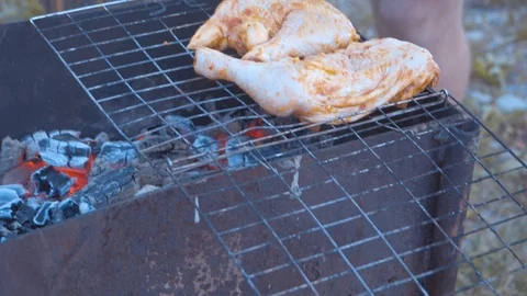 Cocking barbecue on open fire in mountain on nature Stock Footage 106542913