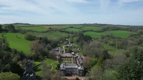 Cockington, South Devon, England: DRONE VIEWS: Cockington Court and Church Stock Footage 272291394