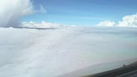 In cockpit above clouds flat layer with storm head left Stock Footage 160976522