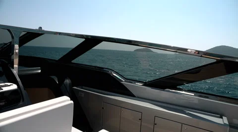 Cockpit and glass windshield on the upper deck of a luxury yacht Stock Footage 56280676