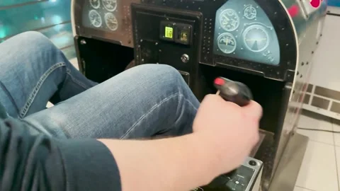 Cockpit in an arcade-style training simulator, joystick-based aircraft Stock Footage 306165289