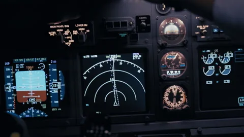 Cockpit avionics panel with flight instruments during flight Stock Footage 326178919