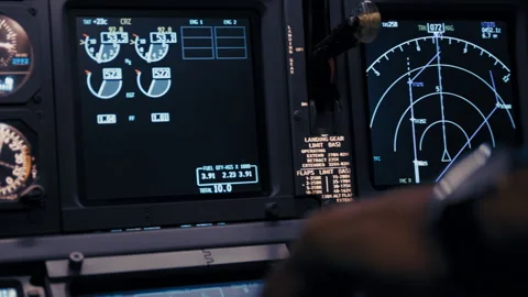 Cockpit avionics panel with flight instruments during flight Stock-Footage 326179154