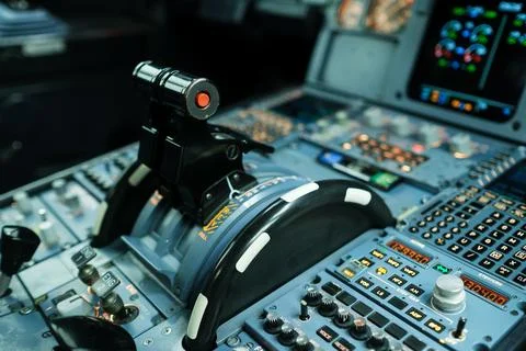 The cockpit control panel features numerous buttons, switches, and a throttle Stock Photos