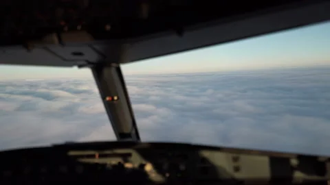 Cockpit, Flightdeck - Airbus A320 Airplane Flying over Clouds at Sunrise/Sunset Stock Footage 172458941