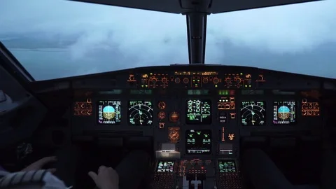 Cockpit (Flightdeck) - Airplane Flying Through Clouds on Approach to Airport Stock Footage 82748205
