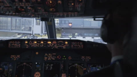 Cockpit (Flightdeck) - Boeing 737 Airplane Arrives at Gate after Landing, Pilot Stock Footage 171478090