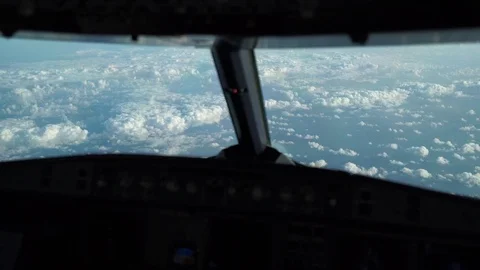 Cockpit (Flightdeck) - Scattered Clouds seen from Flying A320 Airplane Video stock 83221031