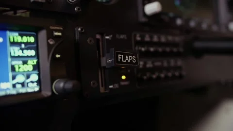 Cockpit indicators.training in flight simulator.pilot's hand presses open flaps Stock Footage 208628061