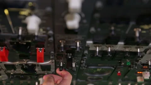 The cockpit of a passenger airplane. Multiple buttons on a planes console ar 스톡 동영상 137612734