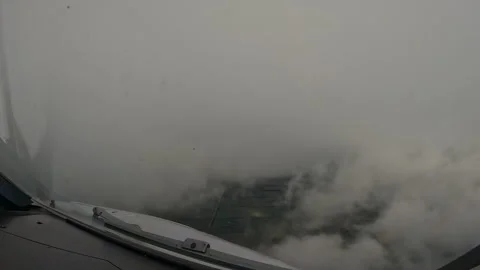 Cockpit Time-Lapse Flying Above Rain Showers and Storm Clouds Stock Footage 340539933
