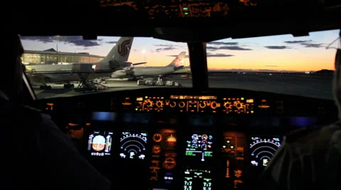 Cockpit view of airplane taxiing at night Stock Footage