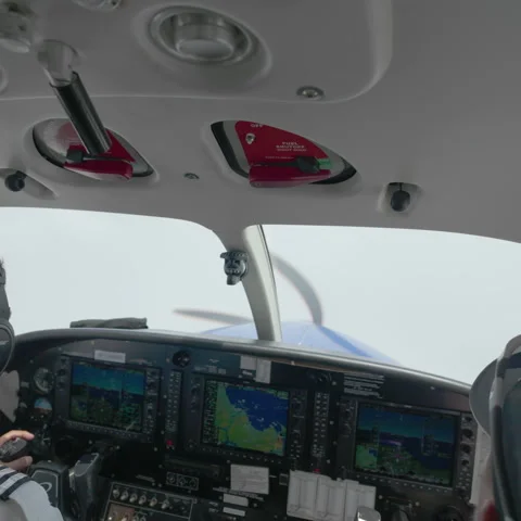 Cockpit view flying single engine propeller plane through clouds Stock Footage 333120366