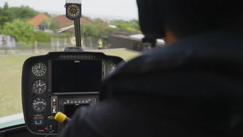 Cockpit view from a helicopter with pilot, showcasing instruments Stock Footage 271230511