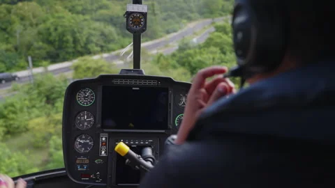Cockpit view from a helicopter with pilot, showcasing instruments Stock Footage 271470634