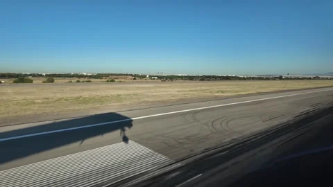 Cockpit View of a Jet Airplane Shadow on the Ground in a Real Time Landing at Stock Footage 342969355