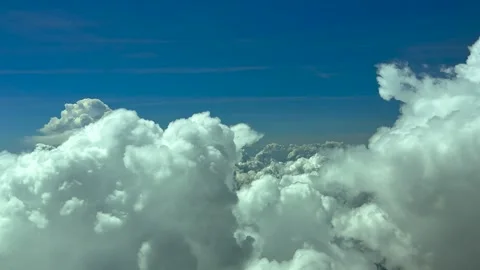 Cockpit View of a Peaceful Cloudscape with Storm Cumulus Clouds Under a Blue Stock Footage 333982779
