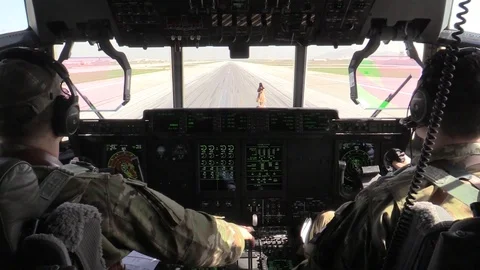 Cockpit view of pilot taking off in C-130J Super Hercules in Afghanistan Stock Footage 88353185