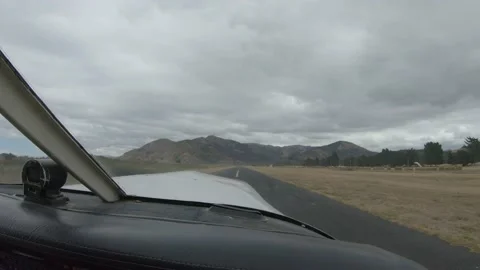 Cockpit view of a small single piston plane taking of from a small airport. Video stock 182364848